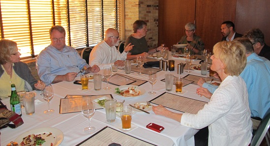 Seminar participants gathered around a table.