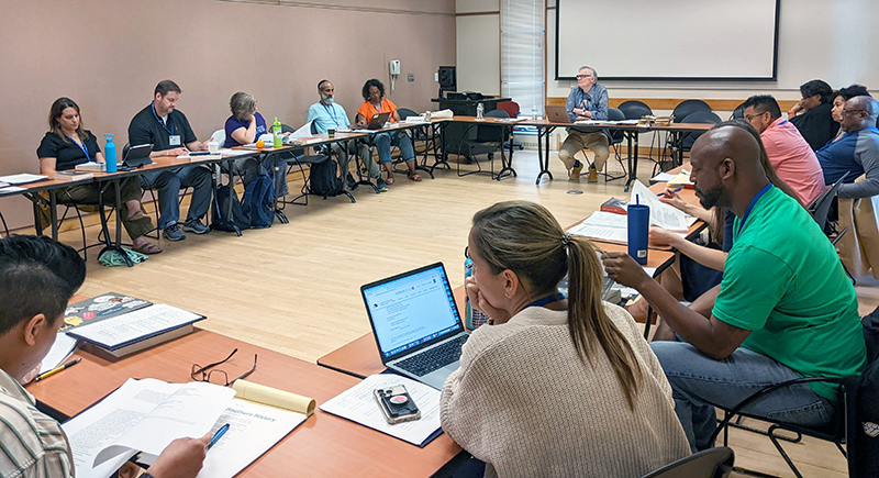 participants seated around open square table