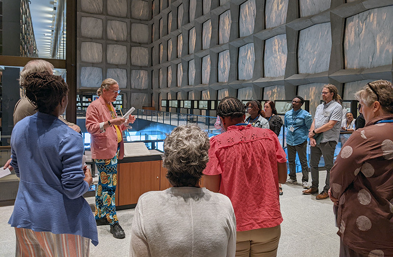 participants standing in a library