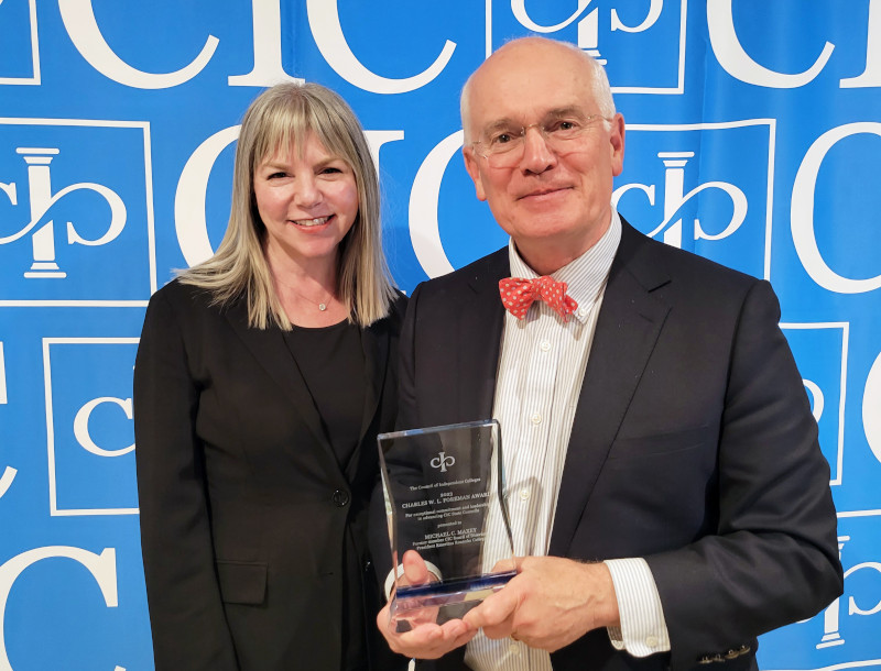 Marjorie Hass and Michael Maxes pose with award