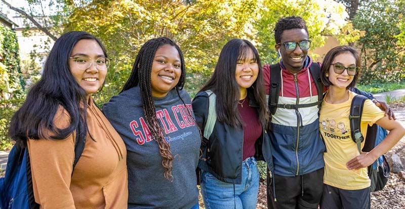 Five students standing outside
