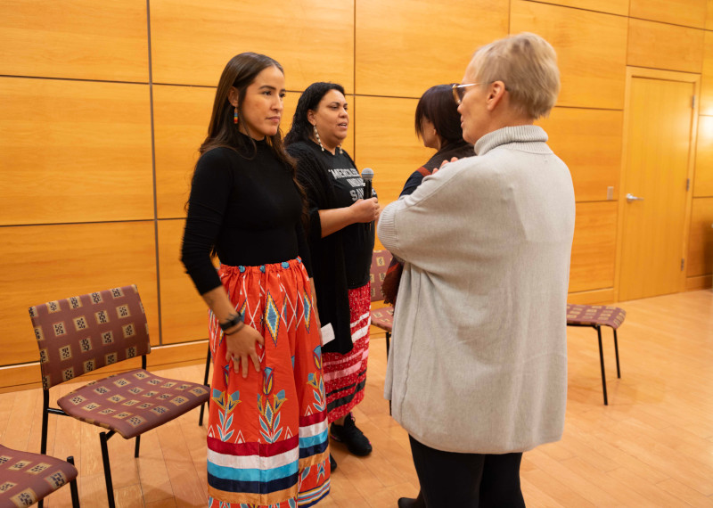 Indigenous women speaking with Concordia campus representatives