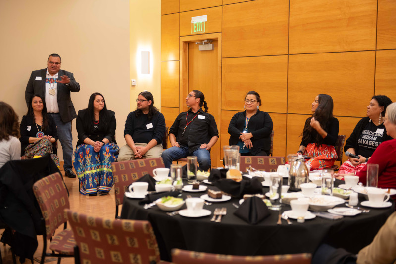 Members of Indigenous community speaking with campus officials