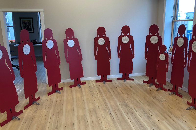 Silhouettes of victims with their stories
