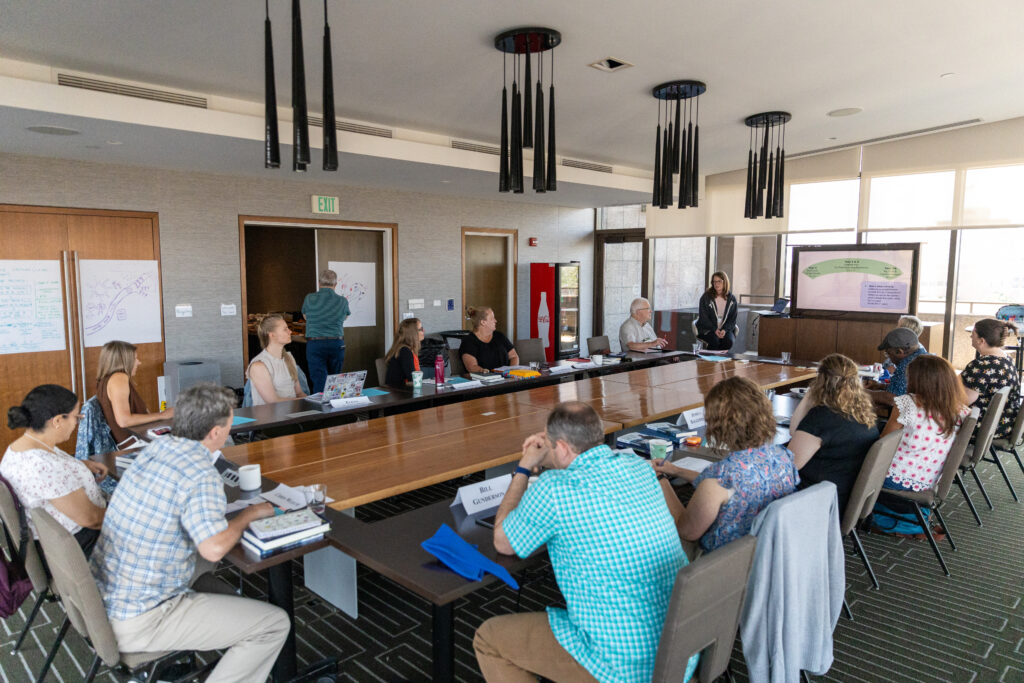 Image of seminar participants seated around a conference table