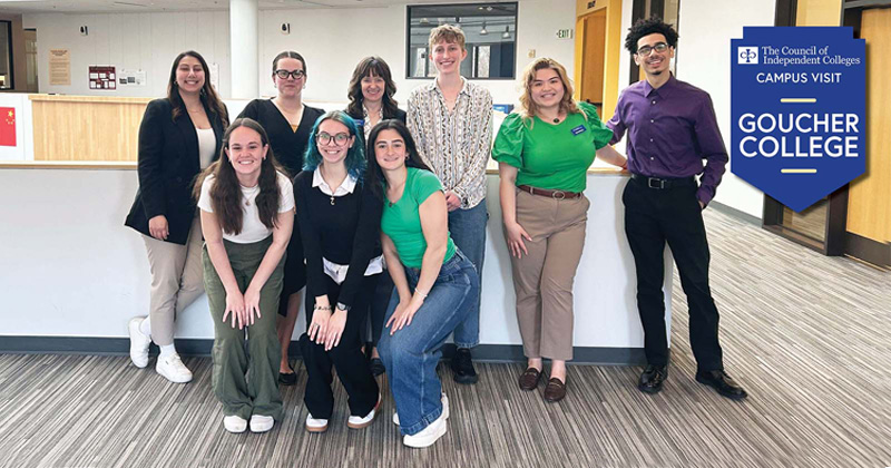 CIC staff pose for photo with students in campus office
