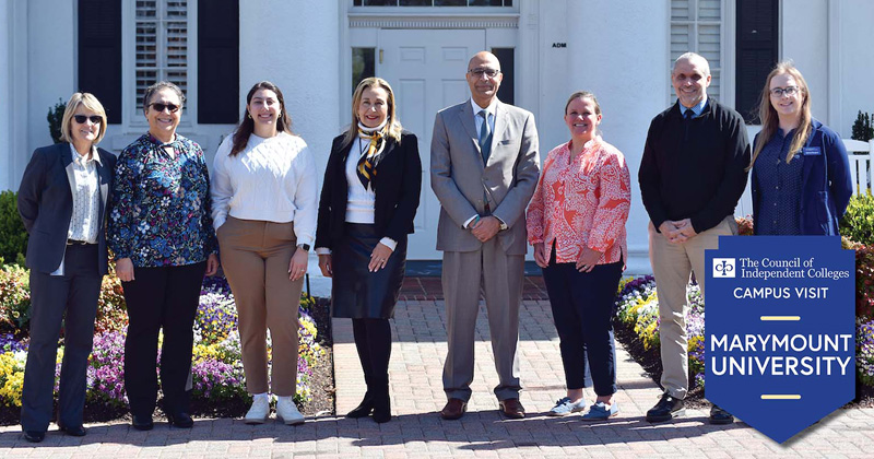 Four CIC staff stand with four campus staff outside