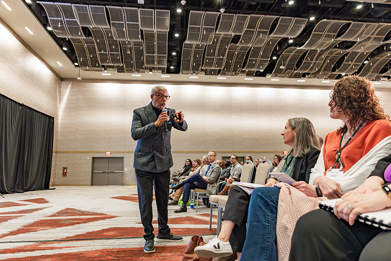 Walter Earl Fluker delivering closing plenary address while standing in front of seated participants