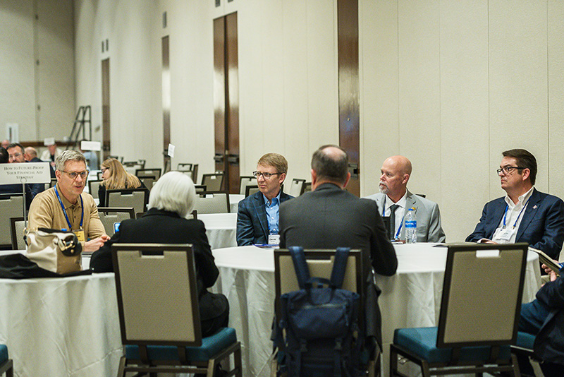 participants seated at roundtable discussion table