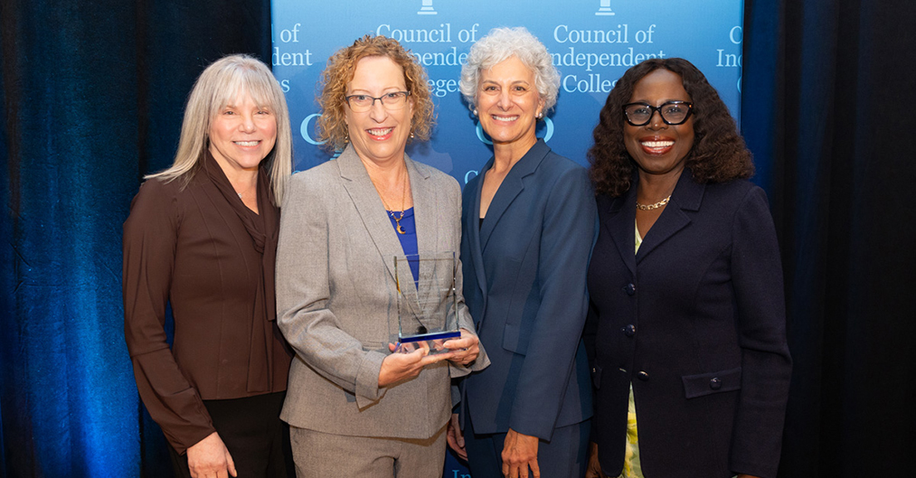 Catherine O'Connell poses with award alongside Marjorie Hass, Barbara Farley, and Titi Ufomata