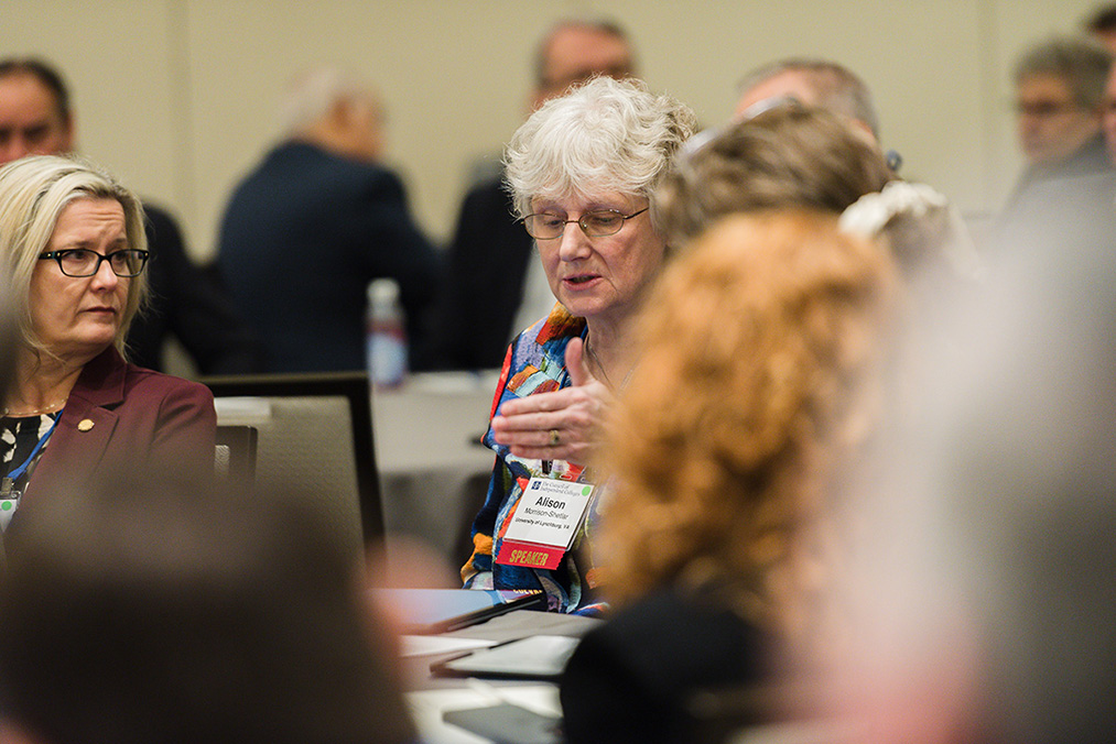 Seated participants speaking to each other during a breakout